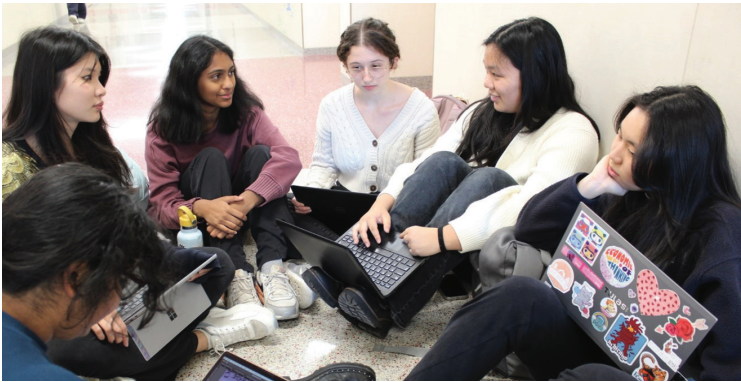 Folio editors at work: Editors of The Folio, Conestoga’s literary magazine, discuss their upcoming Minis. They reviewed the outline of their magazine and the release schedule in a group circle.